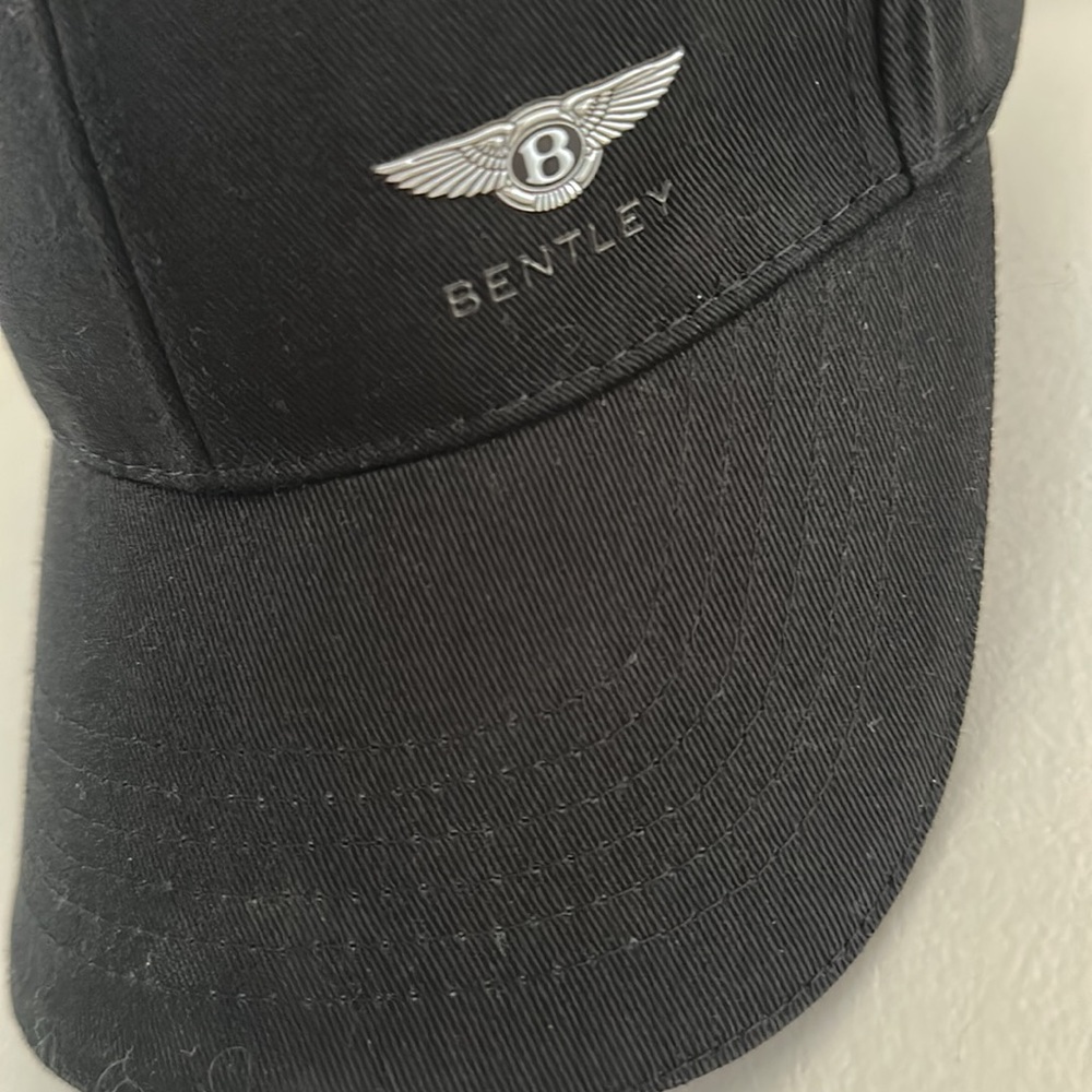 Bentley cap w/ adjustable strap and metal clasp featuring the Bentley B roundel.